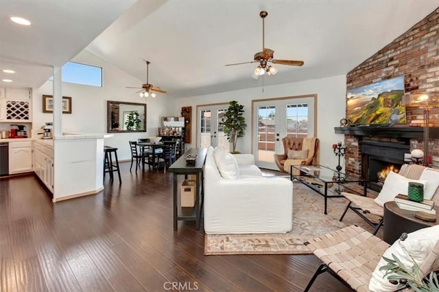 239 Nieto Ave Unit A, Long Beach, CA 90803 - living room featuring ceiling fan, lofted ceiling, a brick fireplace, and healthy amount of natural light