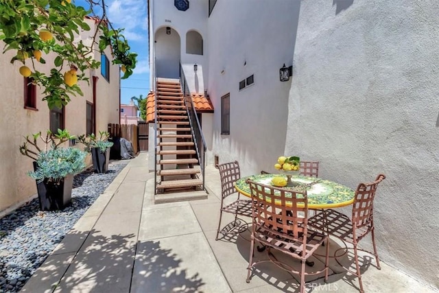 239 Nieto Ave Unit A, Long Beach, CA 90803 - view of patio / terrace featuring stairs and outdoor dining area