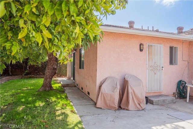 10515 Acoro St, Bellflower, CA 90706 - view of home's exterior with a yard, stucco siding, a patio, and crawl space