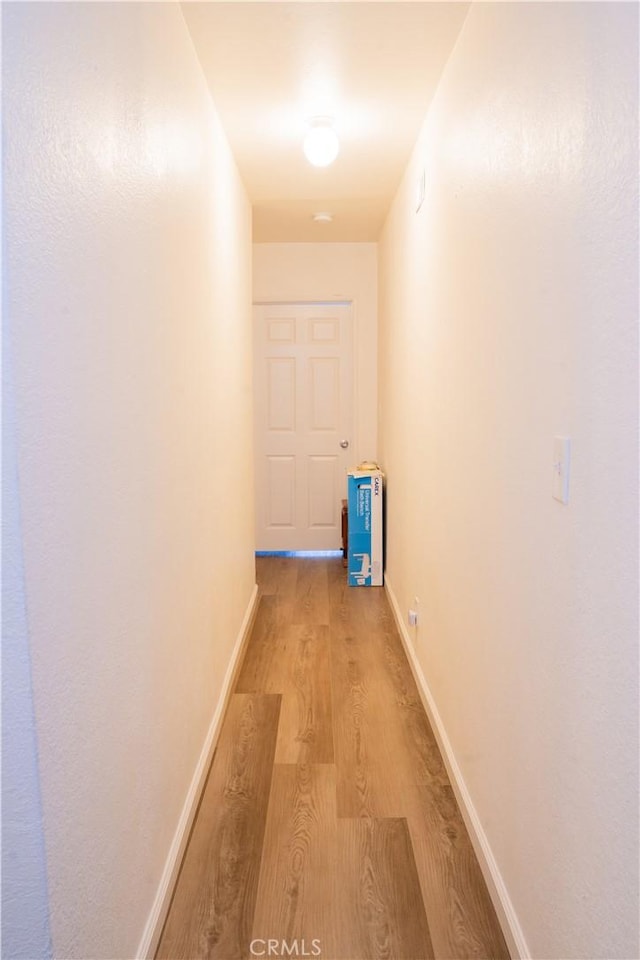 10515 Acoro St, Bellflower, CA 90706 - corridor featuring light wood-style floors and baseboards