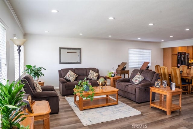 10515 Acoro St, Bellflower, CA 90706 - living area with ornamental molding, recessed lighting, and light wood finished floors