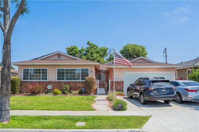 10515 Acoro St, Bellflower, CA 90706 - ranch-style house with a garage, brick siding, stucco siding, and a front lawn