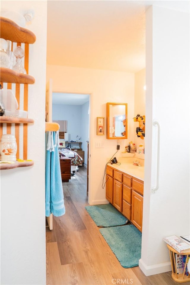 10515 Acoro St, Bellflower, CA 90706 - bathroom featuring wood finished floors and vanity