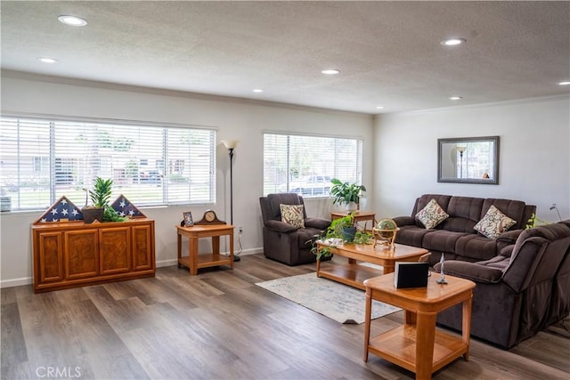 10515 Acoro St, Bellflower, CA 90706 - living room with a textured ceiling, recessed lighting, crown molding, and wood finished floors