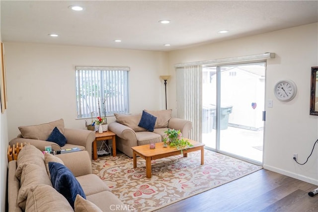 10515 Acoro St, Bellflower, CA 90706 - living room with healthy amount of natural light, wood finished floors, and recessed lighting
