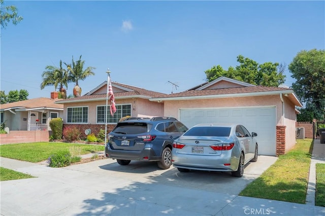 10515 Acoro St, Bellflower, CA 90706 - ranch-style house with driveway, a garage, a front yard, and stucco siding