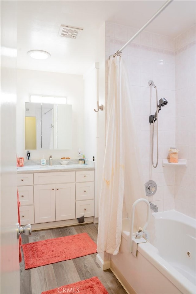 10515 Acoro St, Bellflower, CA 90706 - bathroom with vanity, shower / bath combination with curtain, and wood finished floors