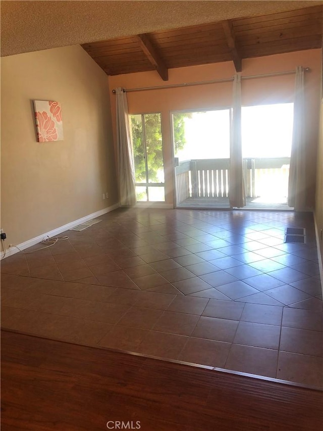8601 International Ave Unit 236, Canoga Park, CA 91304 - spare room featuring dark tile patterned flooring and wooden ceiling