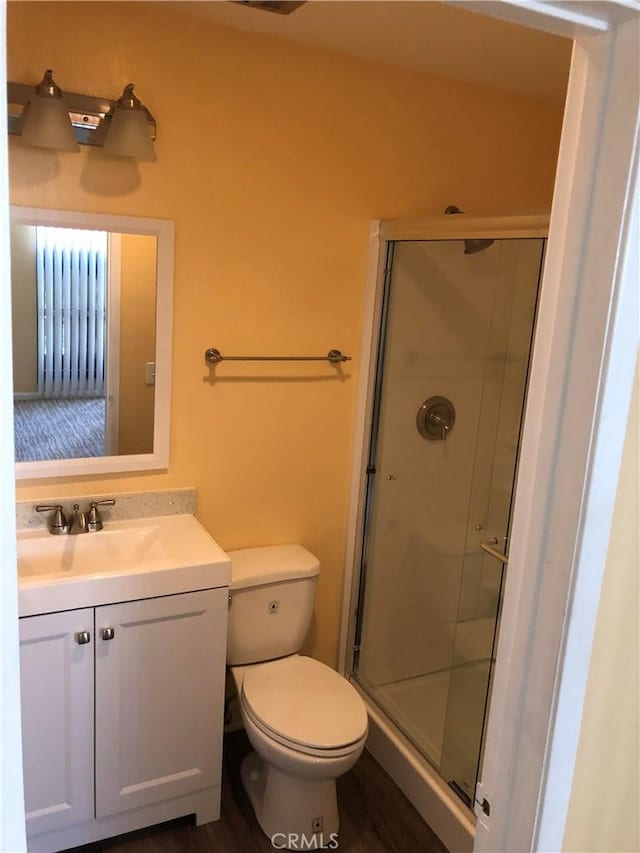 8601 International Ave Unit 178, Canoga Park, CA 91304 - full bath featuring vanity, a shower stall, and wood finished floors