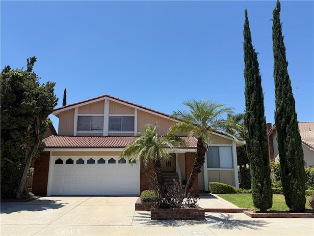 22608 Ironbark Dr, Diamond Bar, CA 91765 - view of front facade featuring a tile roof, driveway, and a garage