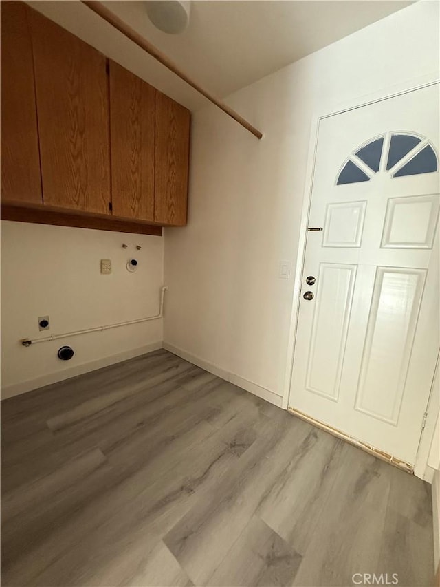22608 Ironbark Dr, Diamond Bar, CA 91765 - laundry area with cabinet space, light wood finished floors, and electric dryer hookup