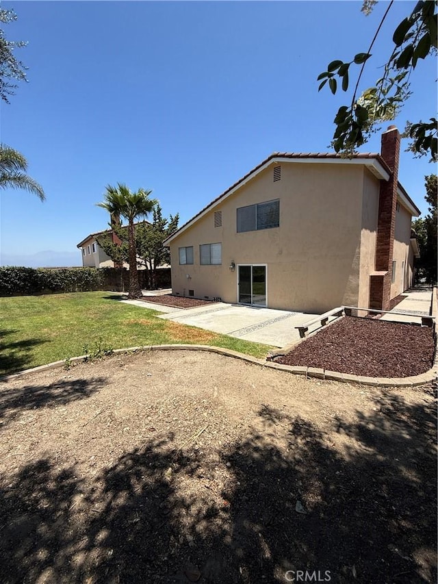 22608 Ironbark Dr, Diamond Bar, CA 91765 - rear view of property with stucco siding, a patio, a yard, and a chimney