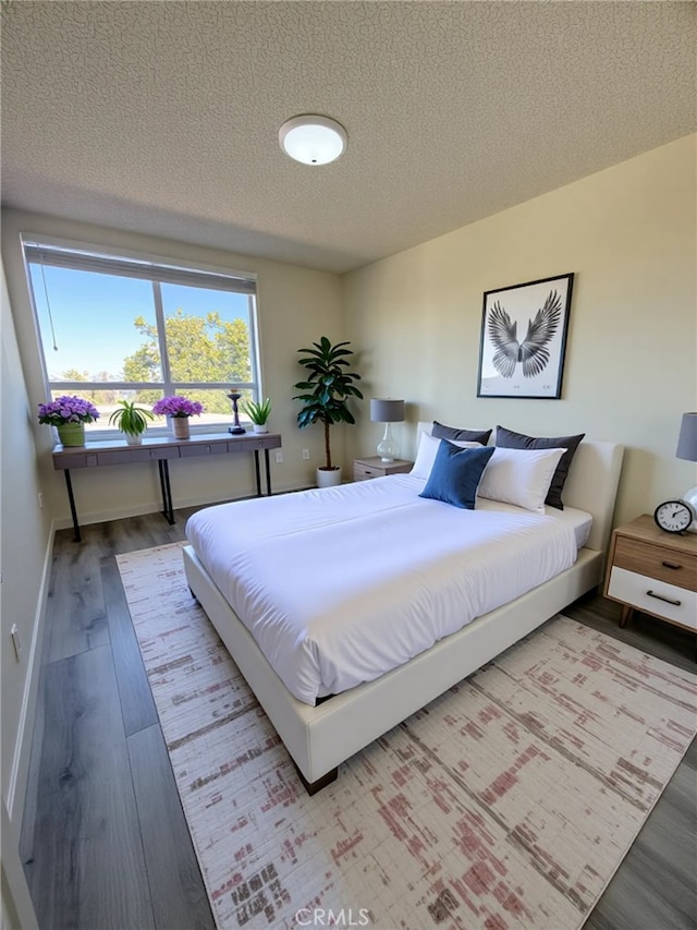 22608 Ironbark Dr, Diamond Bar, CA 91765 - bedroom featuring a textured ceiling and wood finished floors