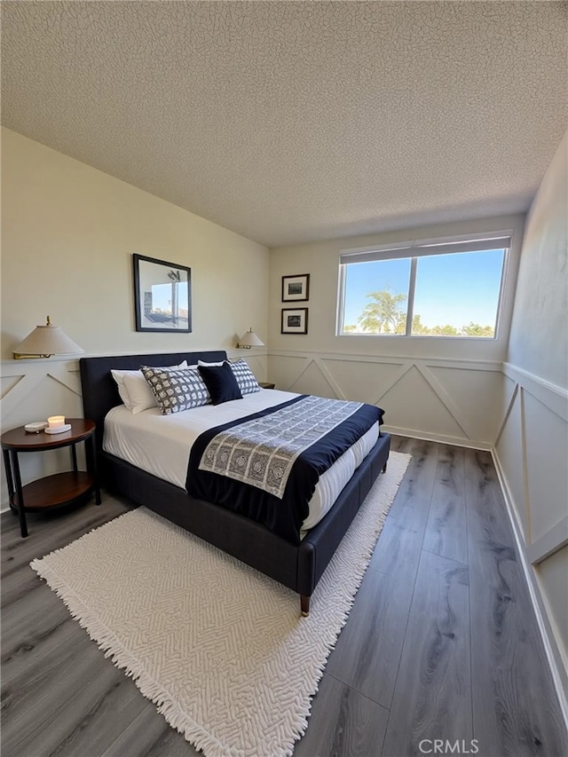 22608 Ironbark Dr, Diamond Bar, CA 91765 - bedroom featuring wood finished floors and a textured ceiling