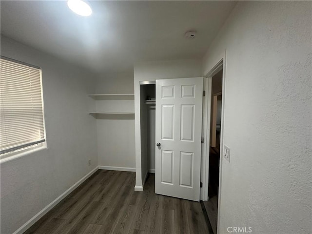 2023 Jewell Ln, Redding, CA 96001 - unfurnished bedroom featuring dark wood-style flooring and a closet