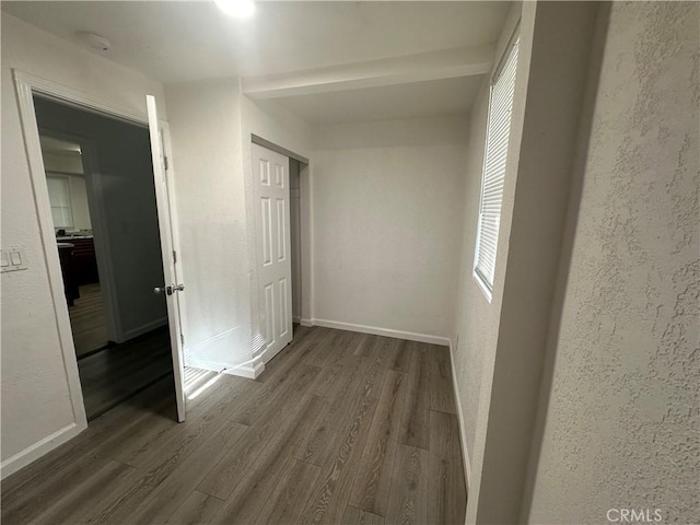 2023 Jewell Ln, Redding, CA 96001 - corridor with dark wood-style flooring and a textured wall