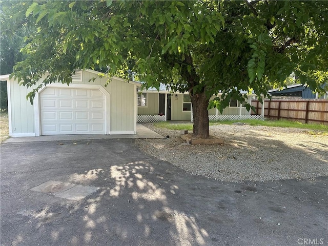 2023 Jewell Ln, Redding, CA 96001 - view of front of home featuring a garage and asphalt driveway