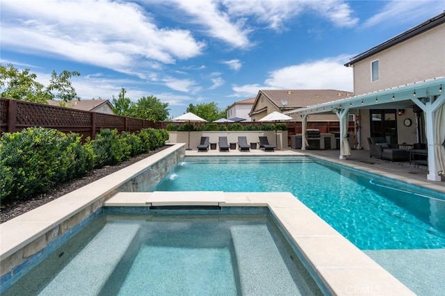 4139 Sunshine Ct, Merced, CA 95340 - view of pool with an outdoor hangout area, a fenced backyard, a patio area, and a pool with connected hot tub