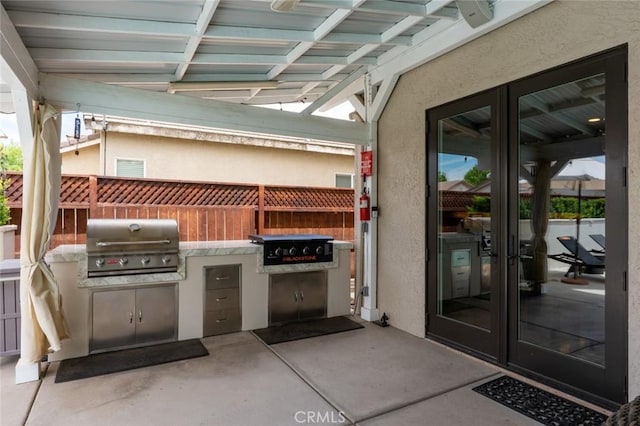 4139 Sunshine Ct, Merced, CA 95340 - view of patio with an outdoor kitchen and french doors