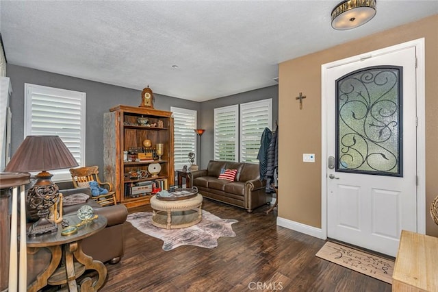 4139 Sunshine Ct, Merced, CA 95340 - foyer entrance featuring wood finished floors and a textured ceiling