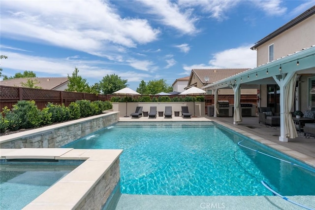 4139 Sunshine Ct, Merced, CA 95340 - view of swimming pool featuring a fenced backyard, a patio area, area for grilling, and an in-ground hot tub
