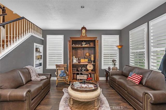 4139 Sunshine Ct, Merced, CA 95340 - living room with a textured ceiling, dark wood finished floors, and stairs