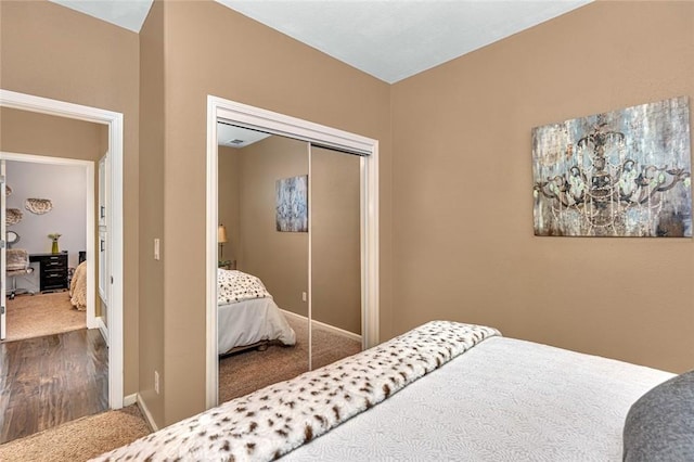 4139 Sunshine Ct, Merced, CA 95340 - carpeted bedroom with a closet and wood finished floors