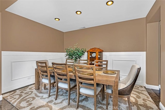 4139 Sunshine Ct, Merced, CA 95340 - dining space featuring a decorative wall, recessed lighting, and wainscoting