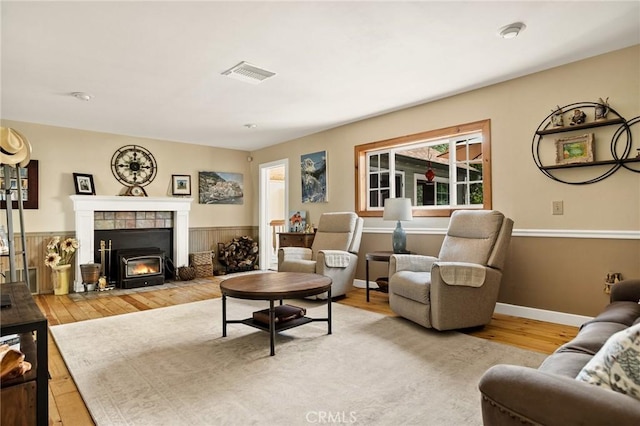 1 Sunny Slope, Running Springs, CA 92382 - living area featuring wood finished floors and a tiled fireplace