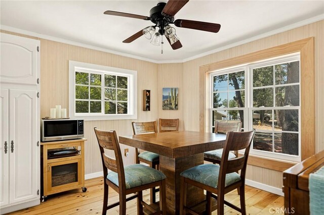 1 Sunny Slope, Running Springs, CA 92382 - dining space with light wood-style floors, crown molding, and a ceiling fan