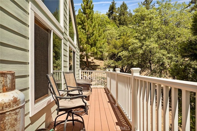 1 Sunny Slope, Running Springs, CA 92382 - wooden deck featuring view of scattered trees