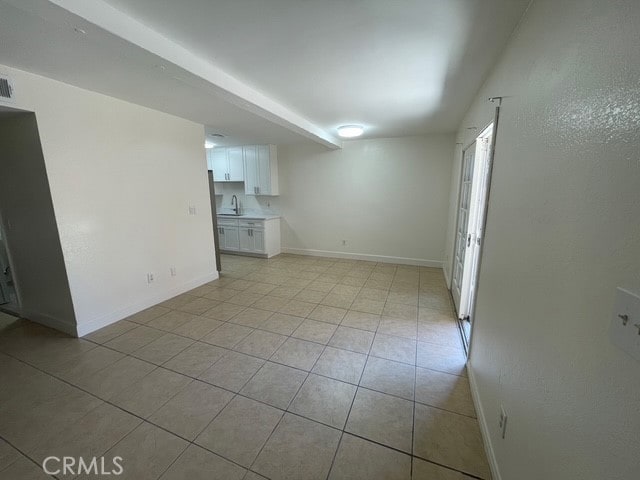 1415 El Sereno Ave Unit 4, Pasadena, CA 91103 - unfurnished living room with light tile patterned floors and baseboards