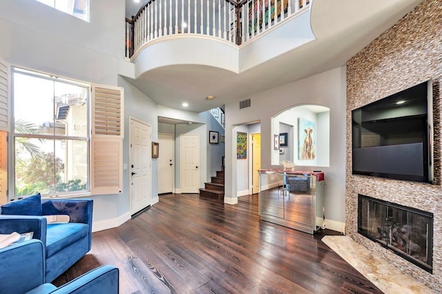 6847 Adolphia Dr, Carlsbad, CA 92011 - entryway featuring healthy amount of natural light, wood finished floors, arched walkways, and a high ceiling