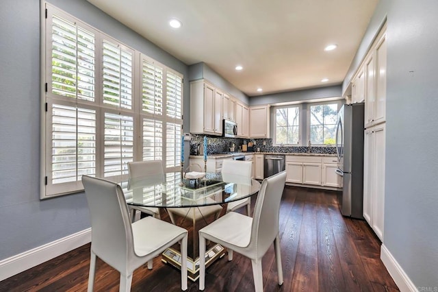 6847 Adolphia Dr, Carlsbad, CA 92011 - dining space featuring dark wood finished floors and recessed lighting