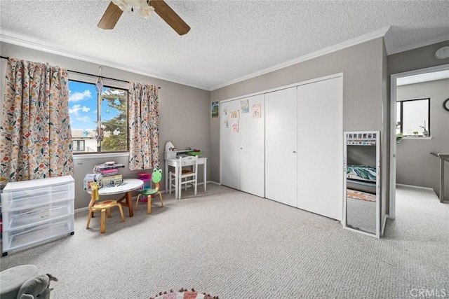 1246 15th St, Los Osos, CA 93402 - rec room with ceiling fan, crown molding, a textured ceiling, and carpet flooring