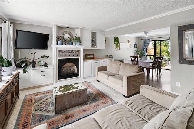 1246 15th St, Los Osos, CA 93402 - living room with a textured ceiling, ornamental molding, a fireplace, and ceiling fan