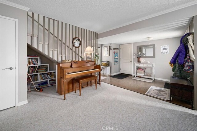 1246 15th St, Los Osos, CA 93402 - sitting room featuring a textured ceiling, carpet, ornamental molding, and stairs