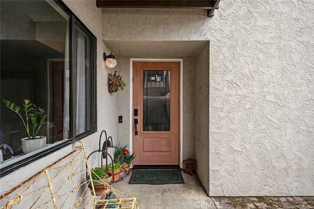 1246 15th St, Los Osos, CA 93402 - doorway to property featuring stucco siding