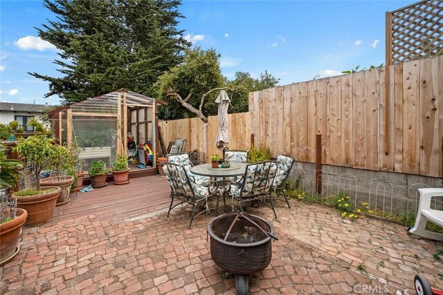 1246 15th St, Los Osos, CA 93402 - fenced backyard featuring an exterior structure, an outbuilding, outdoor dining area, and a patio area