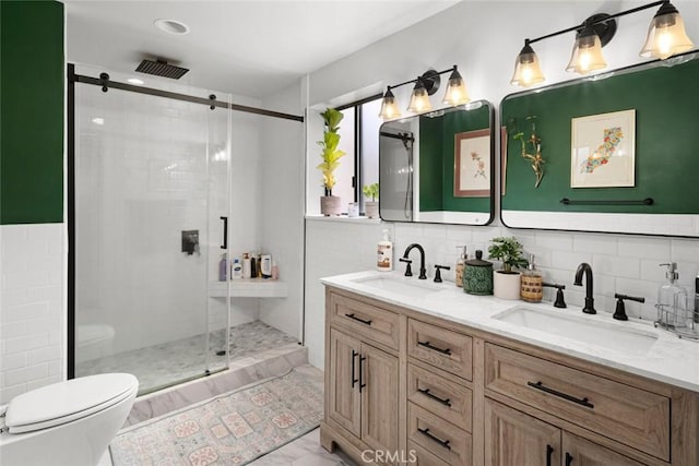 1246 15th St, Los Osos, CA 93402 - bathroom with a shower stall, double vanity, marble look tile flooring, and tasteful backsplash