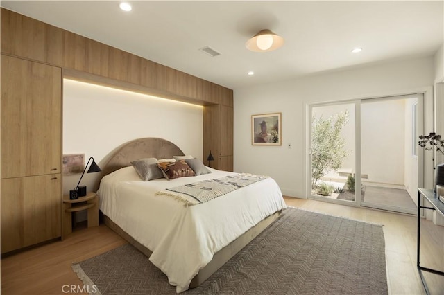 3499 San Rafael Cir, Costa Mesa, CA 92626 - bedroom featuring access to exterior, light wood-type flooring, and recessed lighting