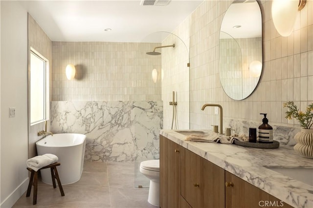 3499 San Rafael Cir, Costa Mesa, CA 92626 - bathroom featuring tile walls, double vanity, walk in shower, and a soaking tub