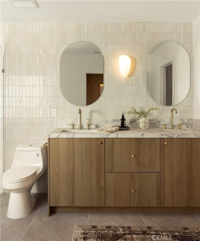 3499 San Rafael Cir, Costa Mesa, CA 92626 - bathroom featuring double vanity and tile walls