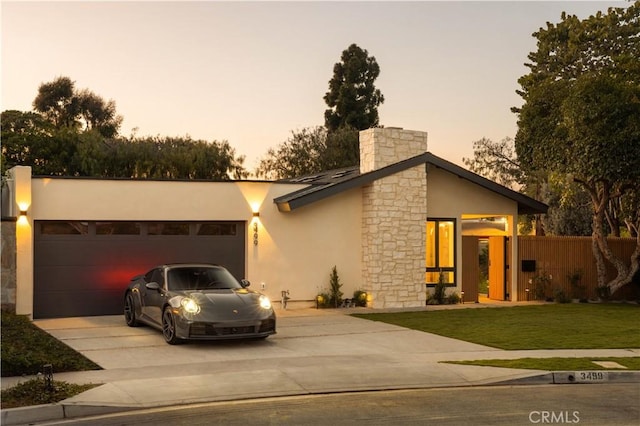 3499 San Rafael Cir, Costa Mesa, CA 92626 - view of front of house featuring concrete driveway, a garage, stone siding, and stucco siding