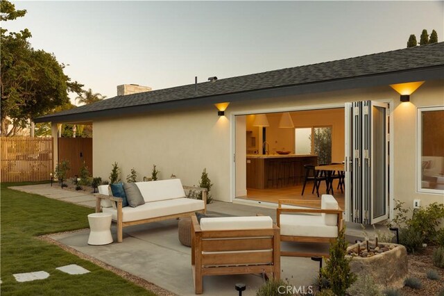 3499 San Rafael Cir, Costa Mesa, CA 92626 - rear view of property featuring an outdoor living space, stucco siding, a patio, and roof with shingles