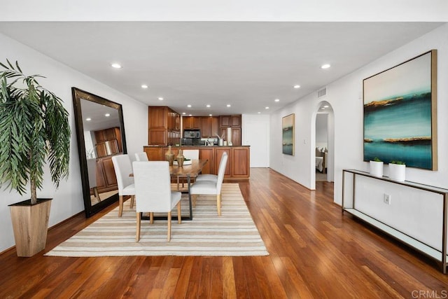 2500 Torrey Pines Rd Unit 1101, La Jolla, CA 92037 - dining space with arched walkways, wood finished floors, and recessed lighting