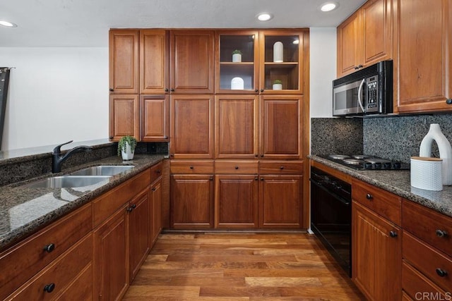 2500 Torrey Pines Rd Unit 1101, La Jolla, CA 92037 - kitchen with stainless steel microwave, oven, light wood finished floors, recessed lighting, and brown cabinetry