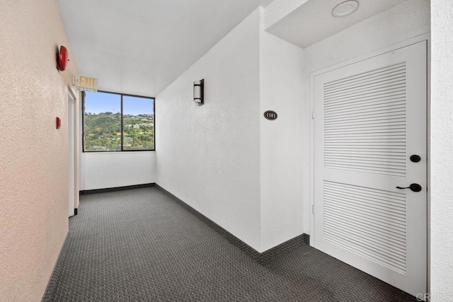 2500 Torrey Pines Rd Unit 1101, La Jolla, CA 92037 - hall with dark carpet and a textured wall