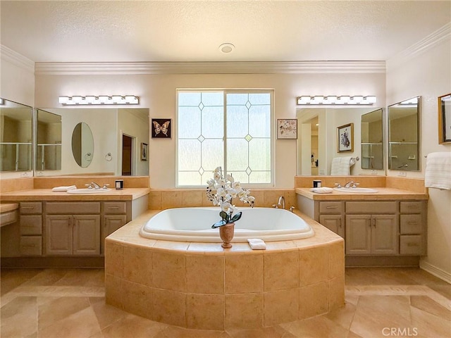 43097 Calle Camellia, Temecula, CA 92592 - bathroom with a garden tub, two vanities, ornamental molding, and tile patterned floors