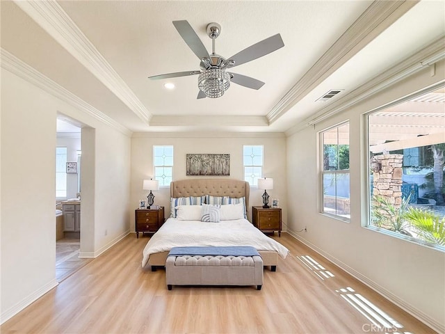 43097 Calle Camellia, Temecula, CA 92592 - bedroom featuring light wood-style floors, a tray ceiling, ensuite bath, ornamental molding, and ceiling fan